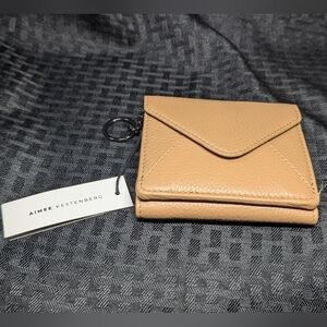 VaChetta And Black Aimee Kestenberg Zip It Up Trifold Wallet.